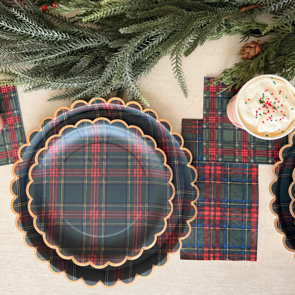 Heritage Tartan Christmas place settings with stacked scalloped plates, plaid napkins and hot cocoa cups