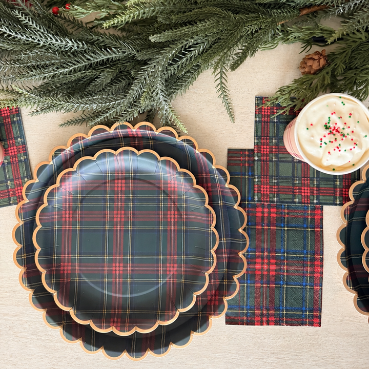 Heritage Tartan Christmas place settings with stacked scalloped plates, plaid napkins and hot cocoa cups